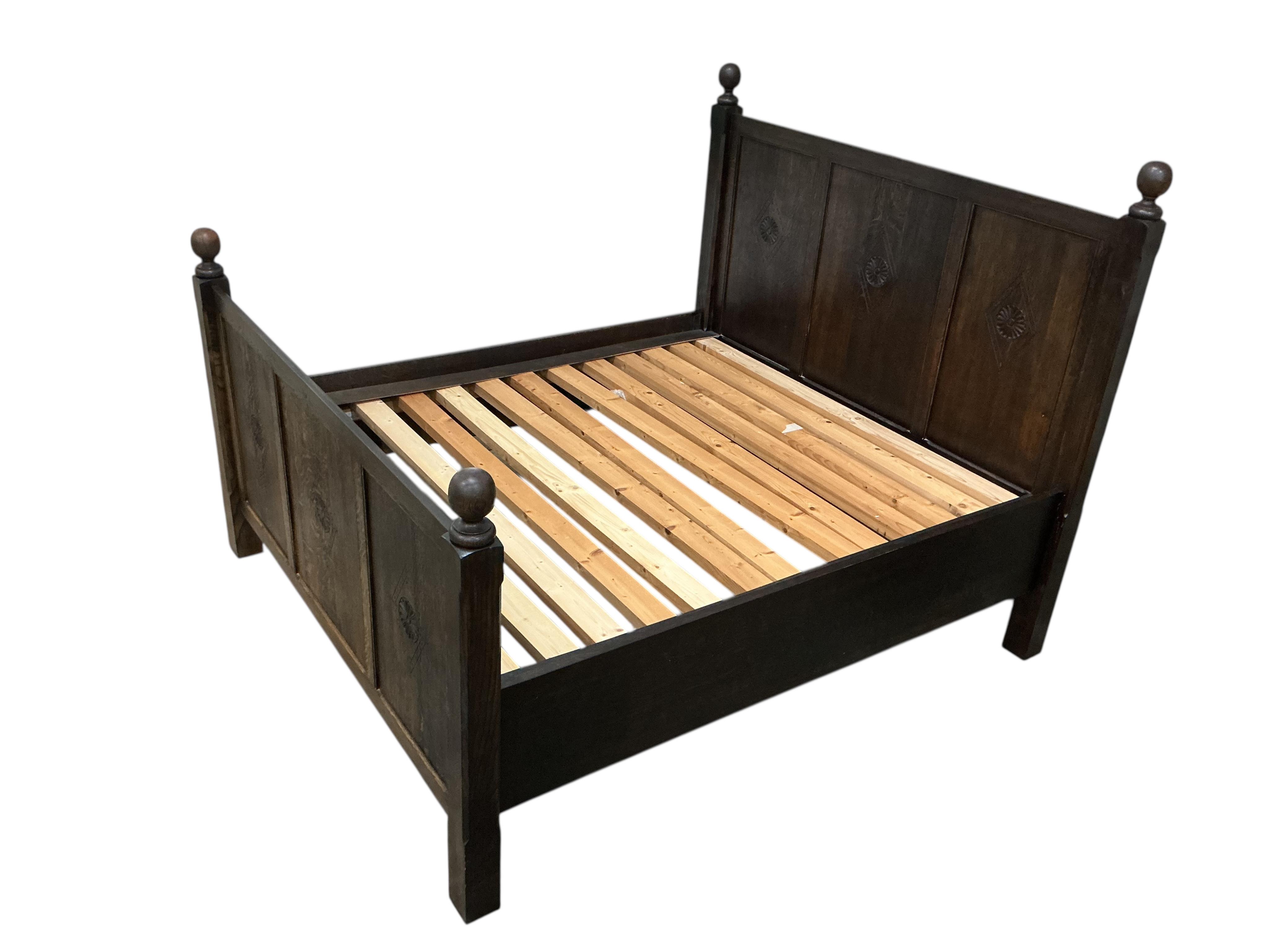 An 18th century style oak Superking double bed frame, width 190cm, length 216cm, height 168cm